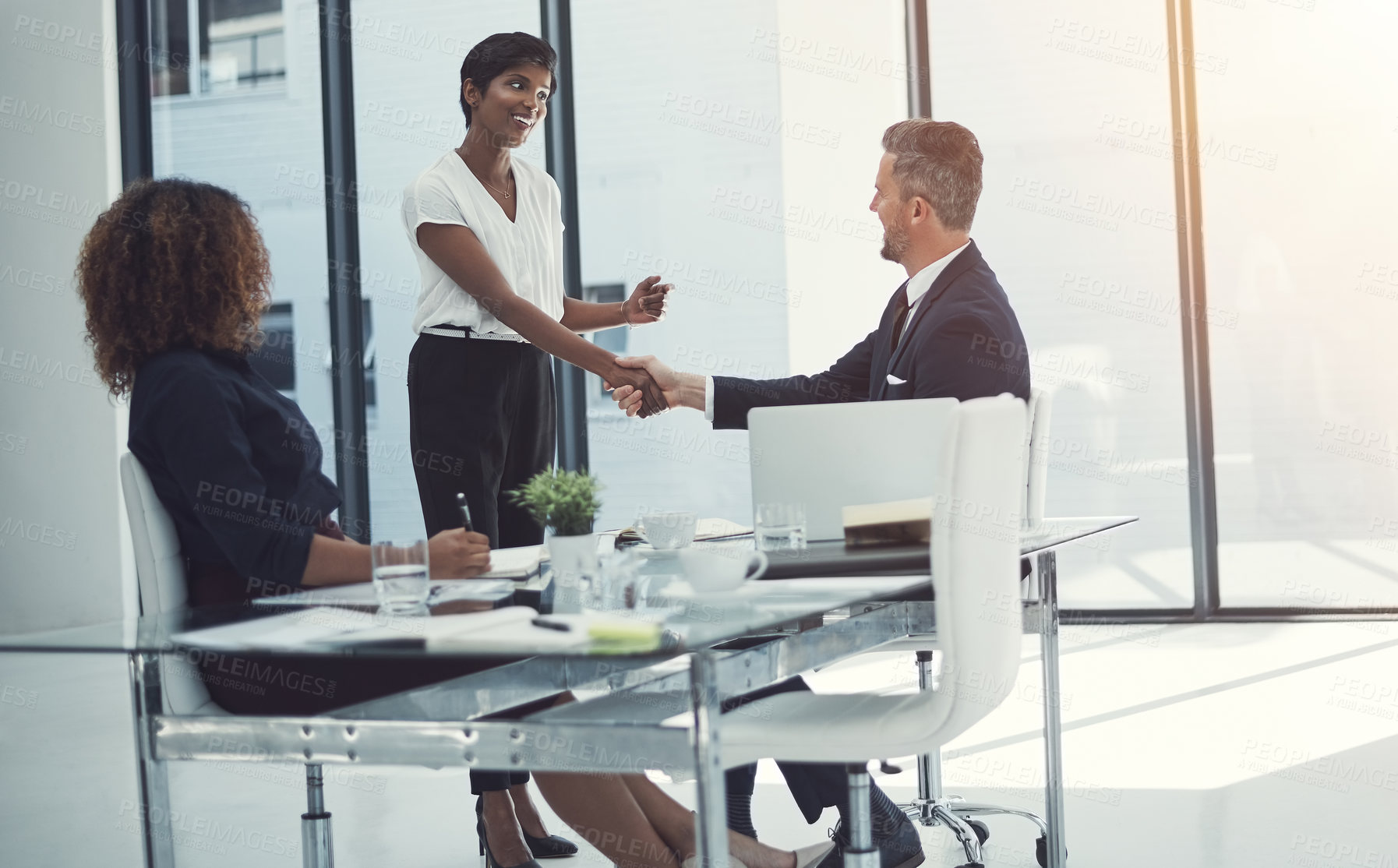 Buy stock photo Shot of a group of businesspeople having a meeting in the boardroom