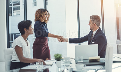 Buy stock photo Shot of a group of businesspeople having a meeting in the boardroom