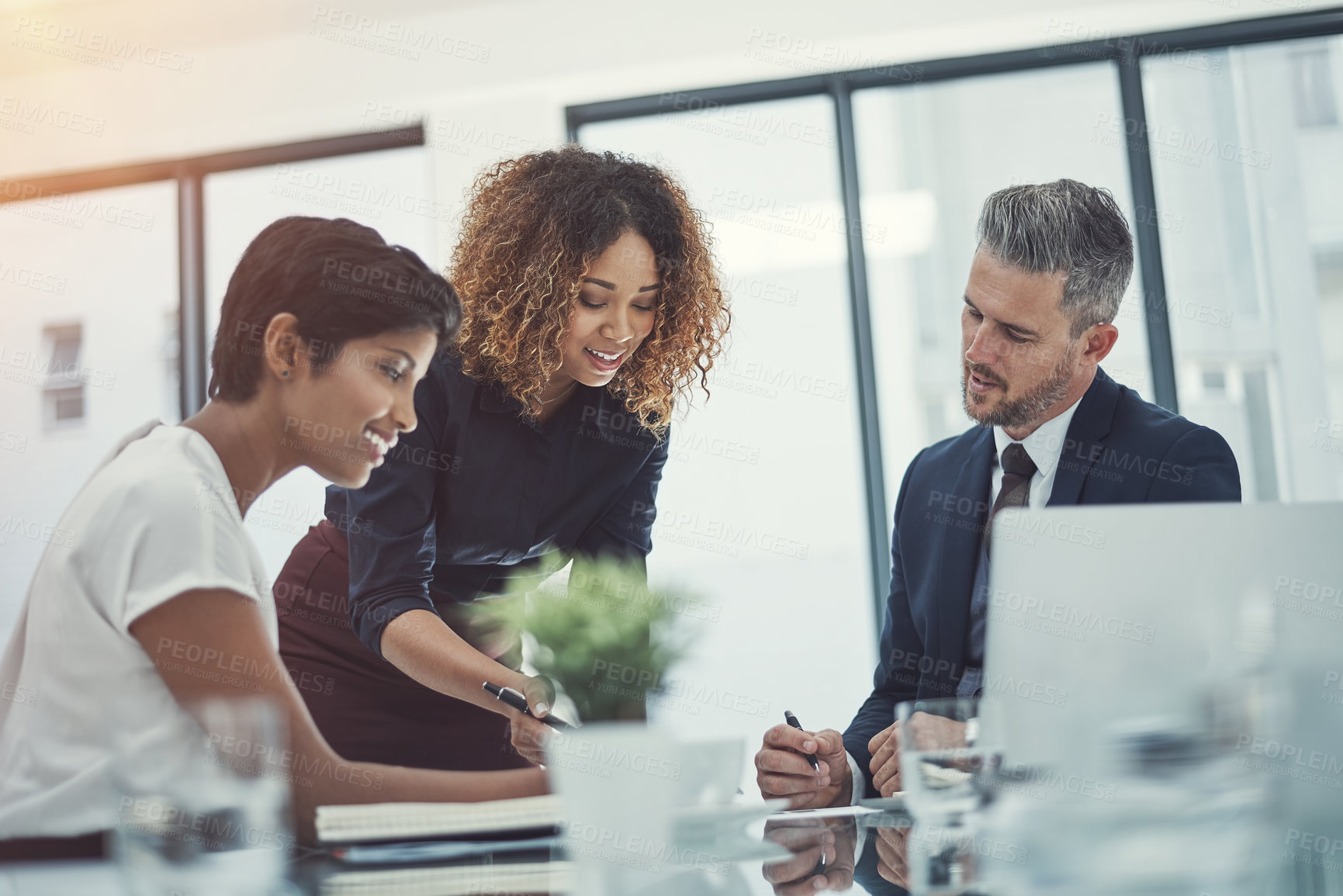 Buy stock photo Shot of a group of businesspeople having a meeting in the boardroom