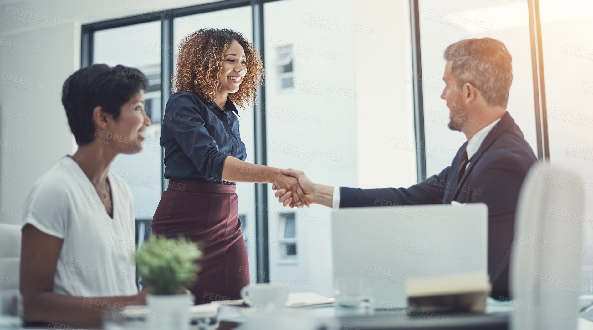 Buy stock photo Shot of a group of businesspeople having a meeting in the boardroom