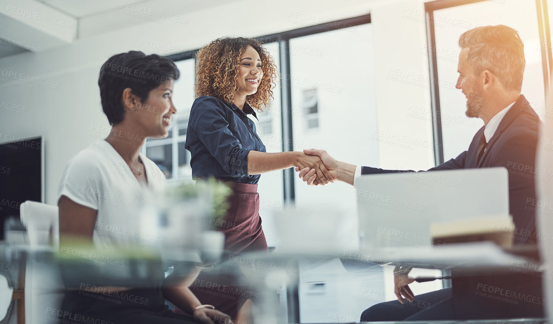 Buy stock photo Shot of a group of businesspeople having a meeting in the boardroom