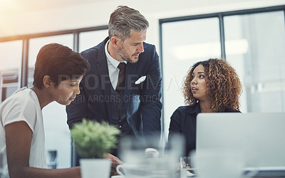 Buy stock photo Shot of a group of businesspeople having a meeting in the boardroom