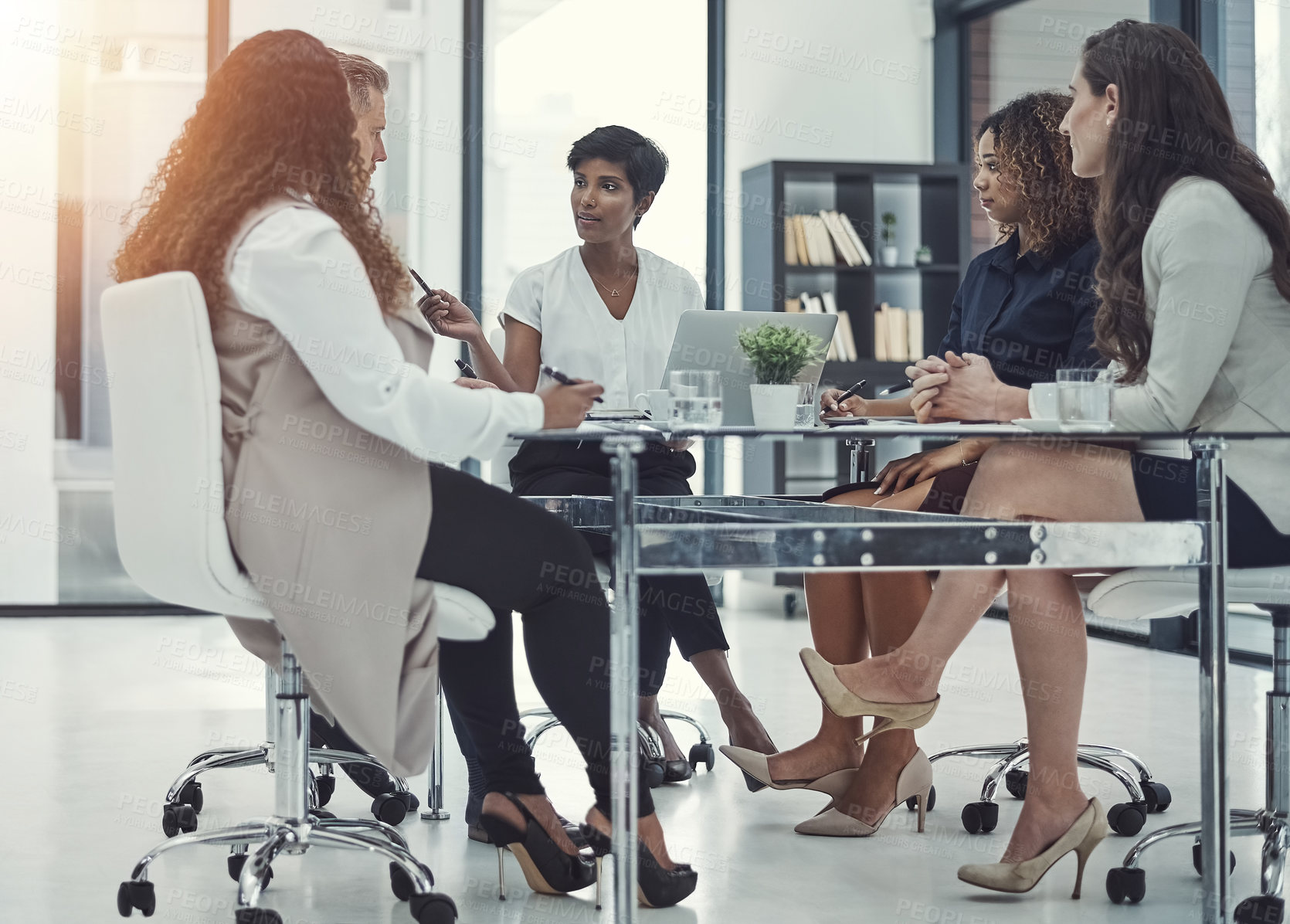 Buy stock photo Shot of a group of colleagues having a meeting in a modern office