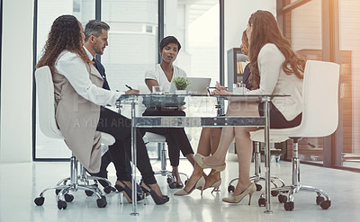 Buy stock photo Shot of a group of colleagues having a meeting in a modern office