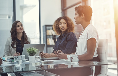 Buy stock photo Shot of a group of colleagues having a meeting in a modern office