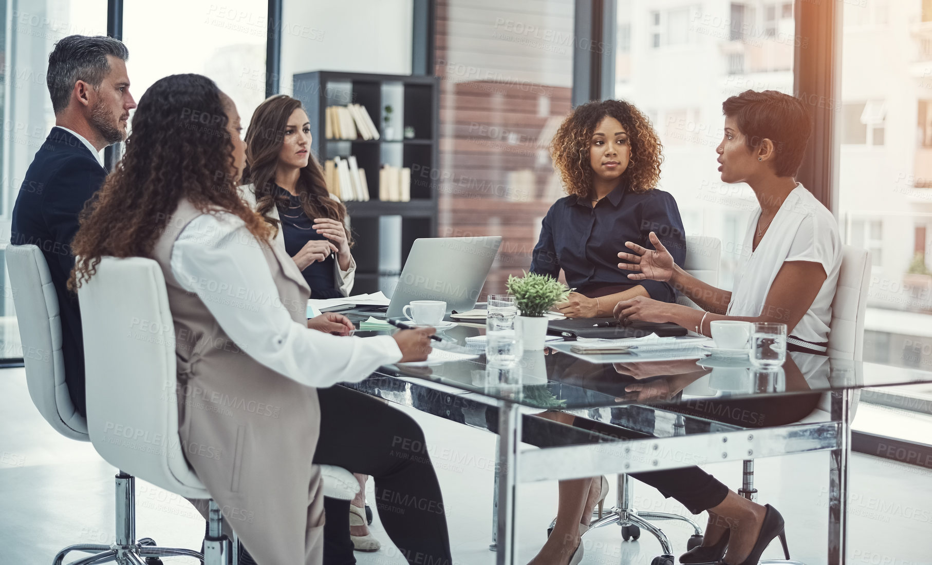 Buy stock photo Shot of a group of colleagues having a meeting in a modern office