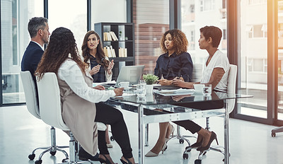 Buy stock photo Shot of a group of colleagues having a meeting in a modern office