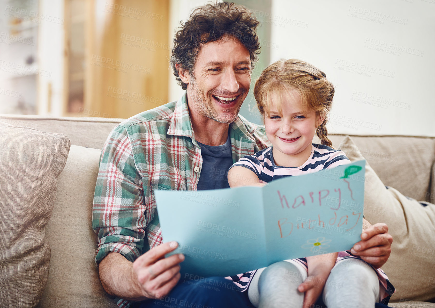 Buy stock photo Birthday card, father and girl on couch, celebration and expression with gift, house and smile. Single parent, dad and daughter with love, present and time together with fun, cheerful and excited