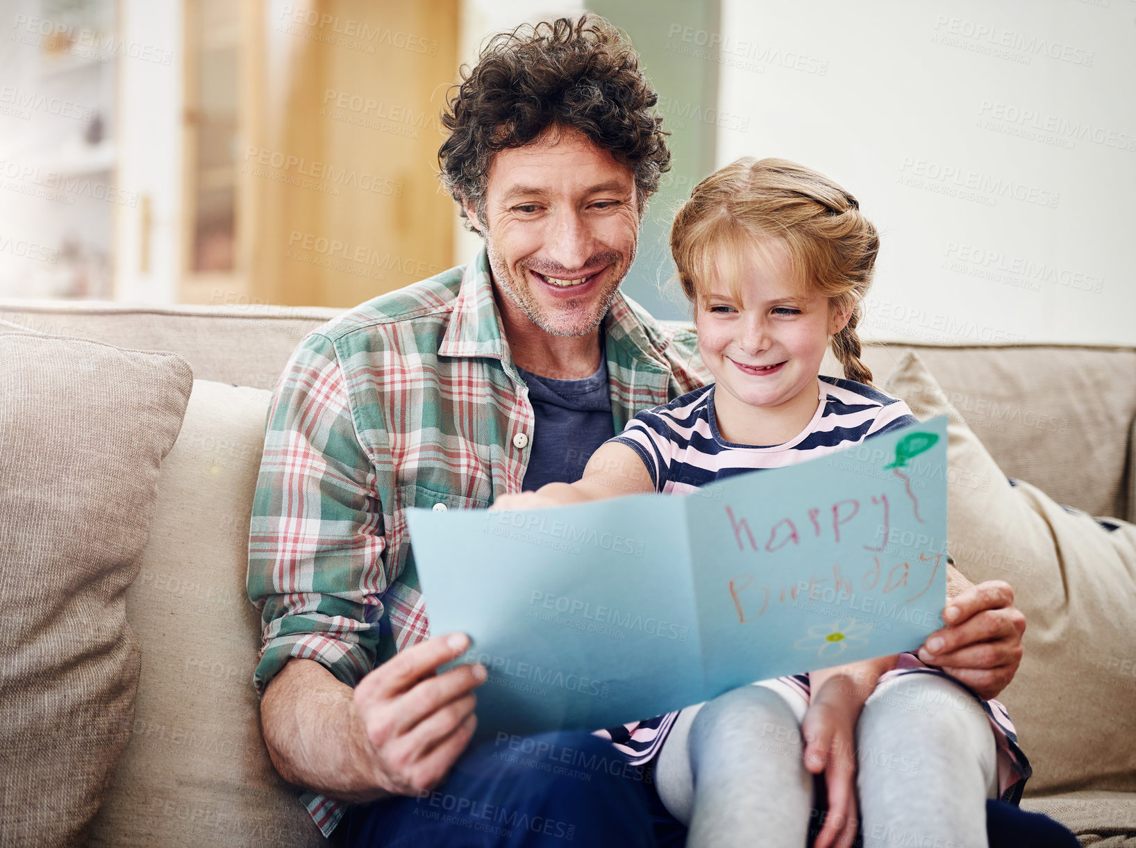 Buy stock photo Birthday card, dad and girl on sofa, celebration and expression with gift, house and love. Parent, father and daughter on couch, present and time together with fun, cheerful and excited with smile