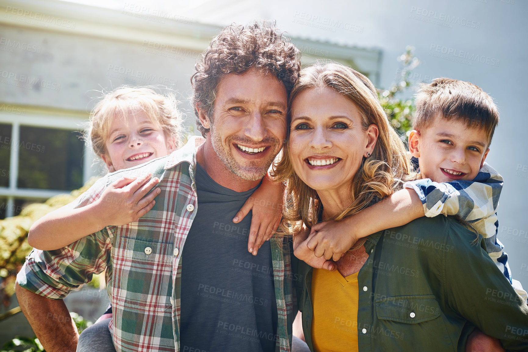 Buy stock photo Portrait of a happy family spending time together outdoors