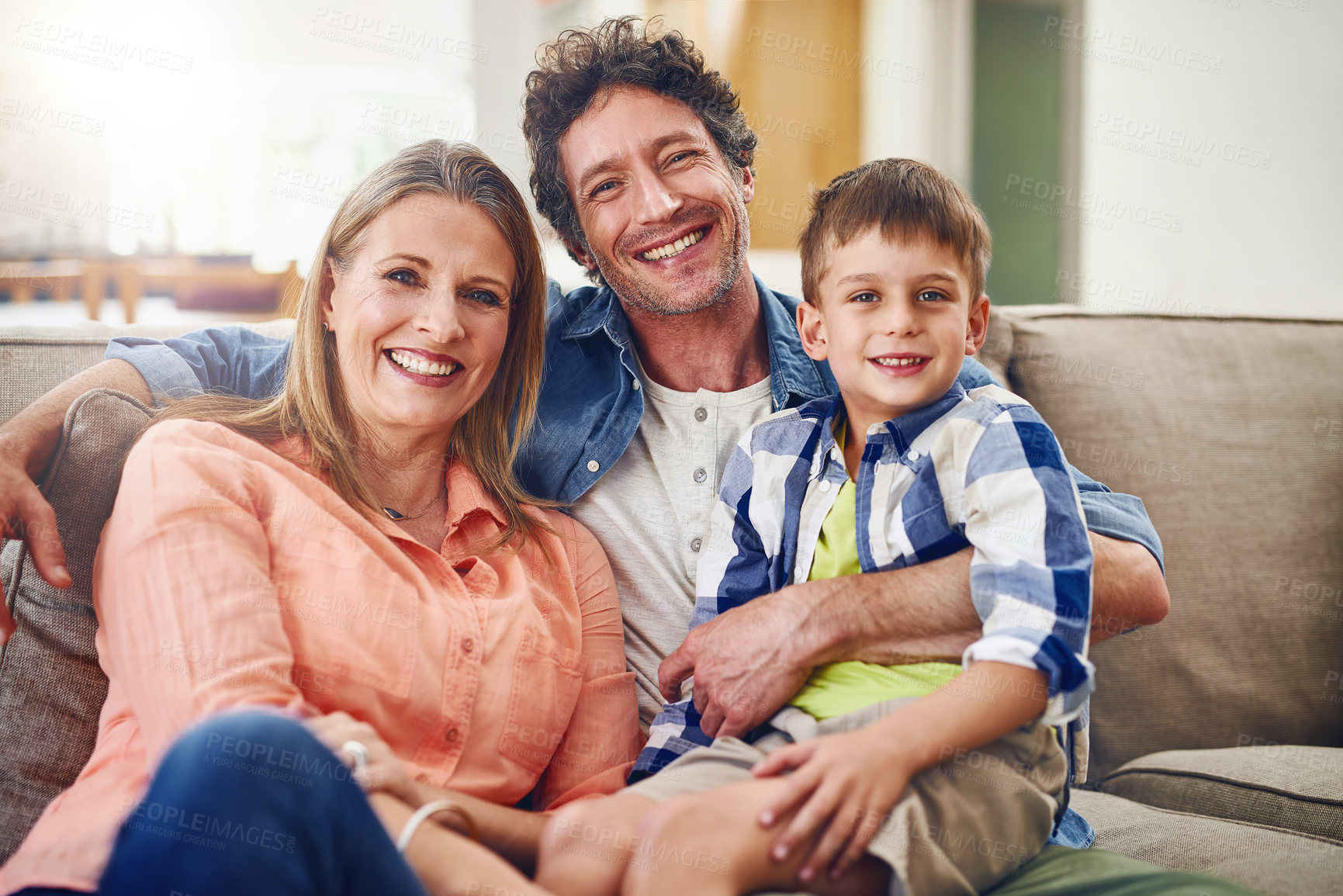 Buy stock photo Portrait of a happy family bonding together at home