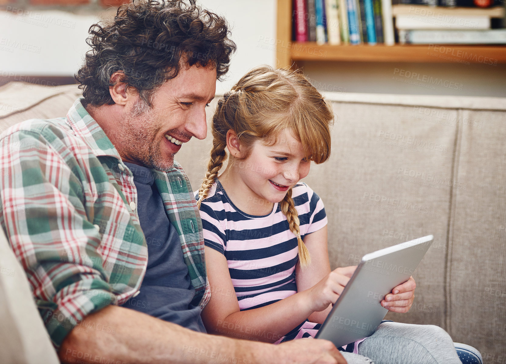 Buy stock photo Bonding, dad and girl with tablet in sofa at home for elearning, child development and knowledge with growth. Parent, kid and support with help, teaching and educational game for entertainment or fun