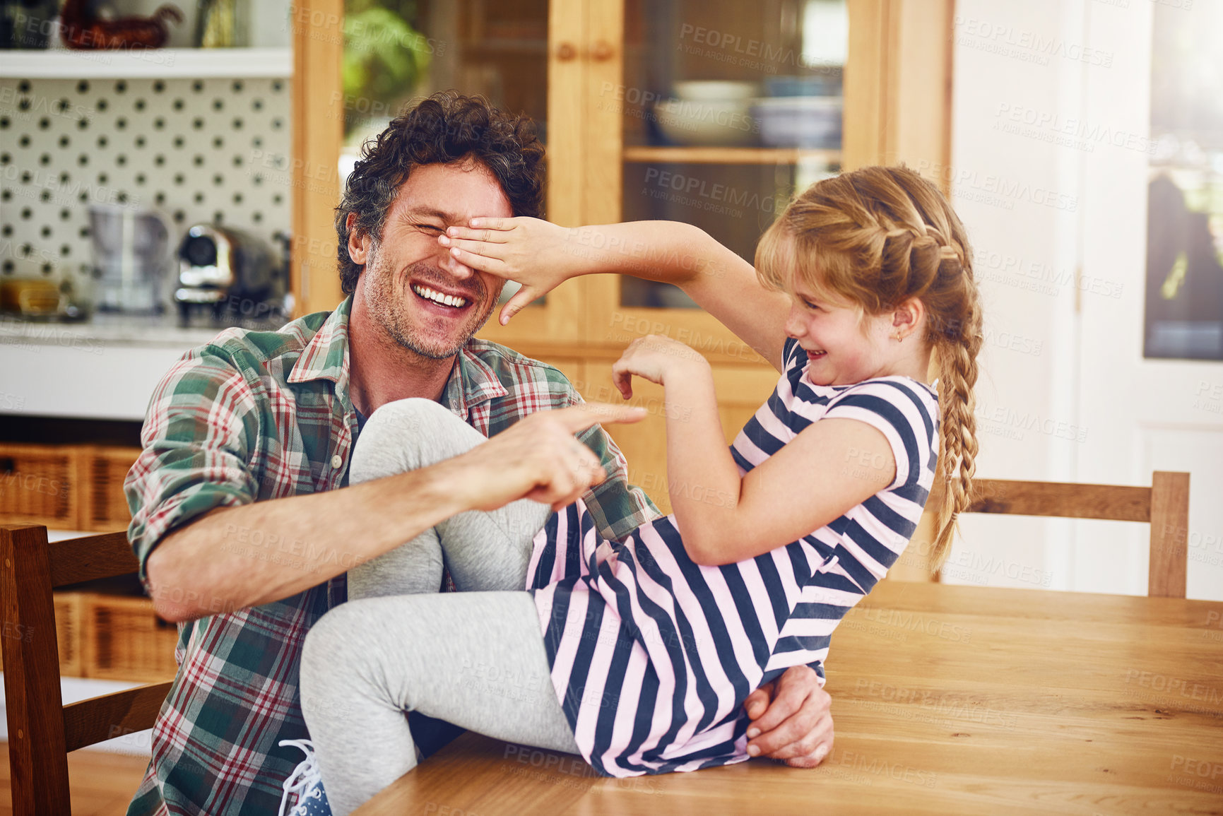 Buy stock photo Care, love and father play with child for bonding in kitchen together, excited and laughing as daughter parent. Girl, dad and weekend in home with kid, fun game and happiness for childhood memory