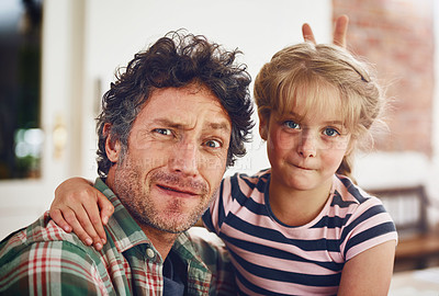 Buy stock photo Portrait of a father and his little daughter having fun together at home