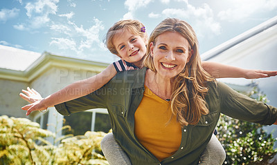 Buy stock photo Portrait of a mother and her little daughter bonding together outdoors