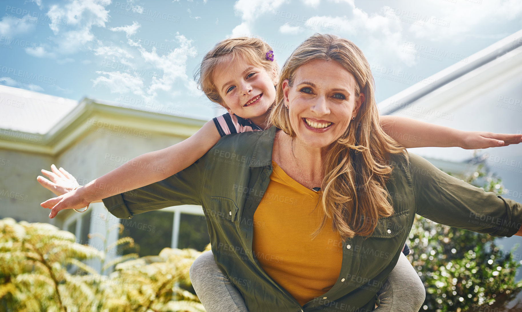 Buy stock photo Portrait of a mother and her little daughter bonding together outdoors