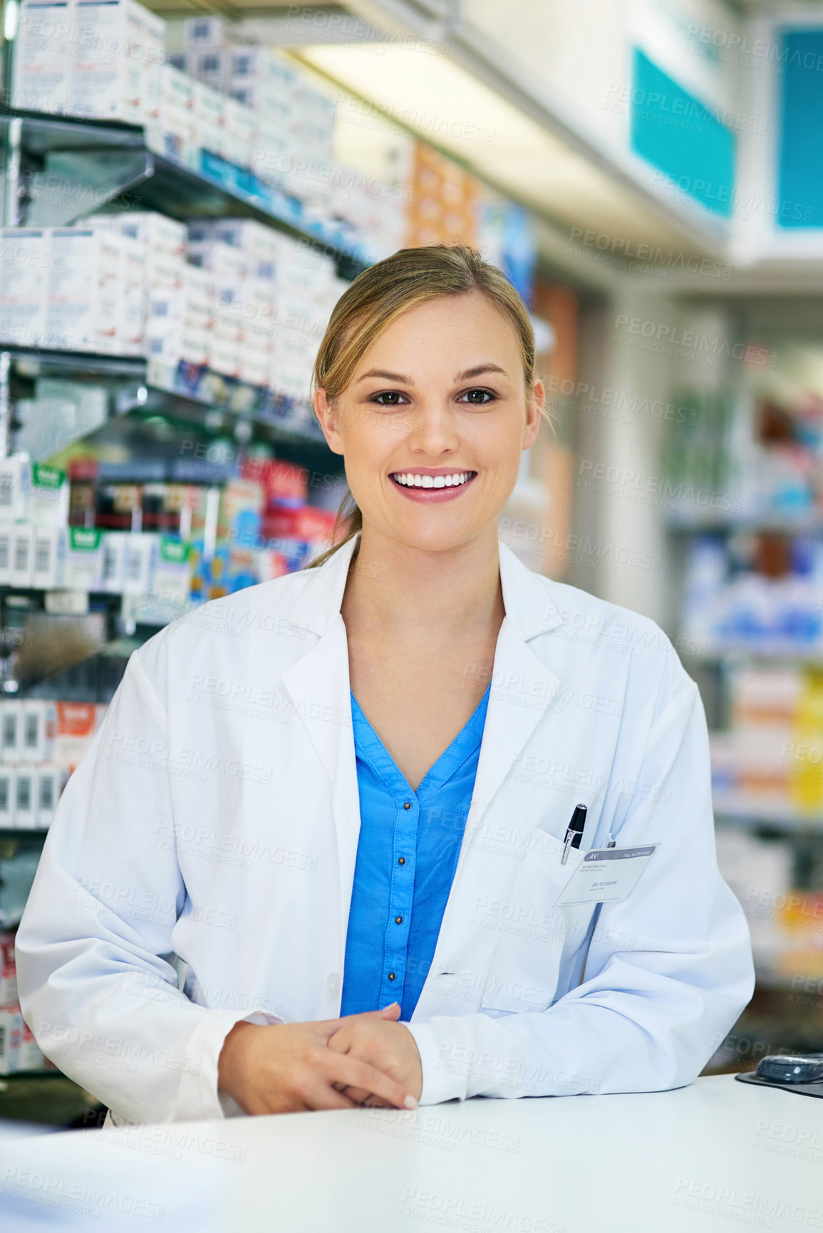 Buy stock photo Portrait of a happy young woman working in a pharmacy