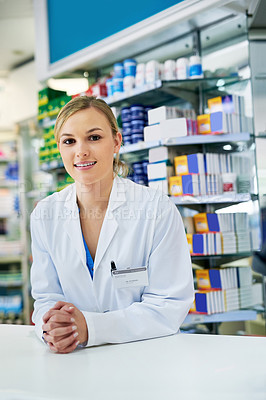 Buy stock photo Portrait of a happy young woman working in a pharmacy