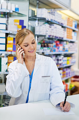 Buy stock photo Woman, pharmacy and phone call with writing for medical job or healthcare, discussion for medicine or stock. Female pharmacist, drug store and communication with mobile for telehealth or advice