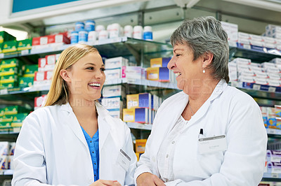 Buy stock photo Woman, colleagues and pharmacy store for healthcare teamwork or laughing, medication or purchase. Female people, humor and chemist internship for tablet consulting or professional, shopping or shelf
