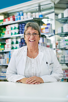 Buy stock photo Portrait of a happy mature woman working in a pharmacy