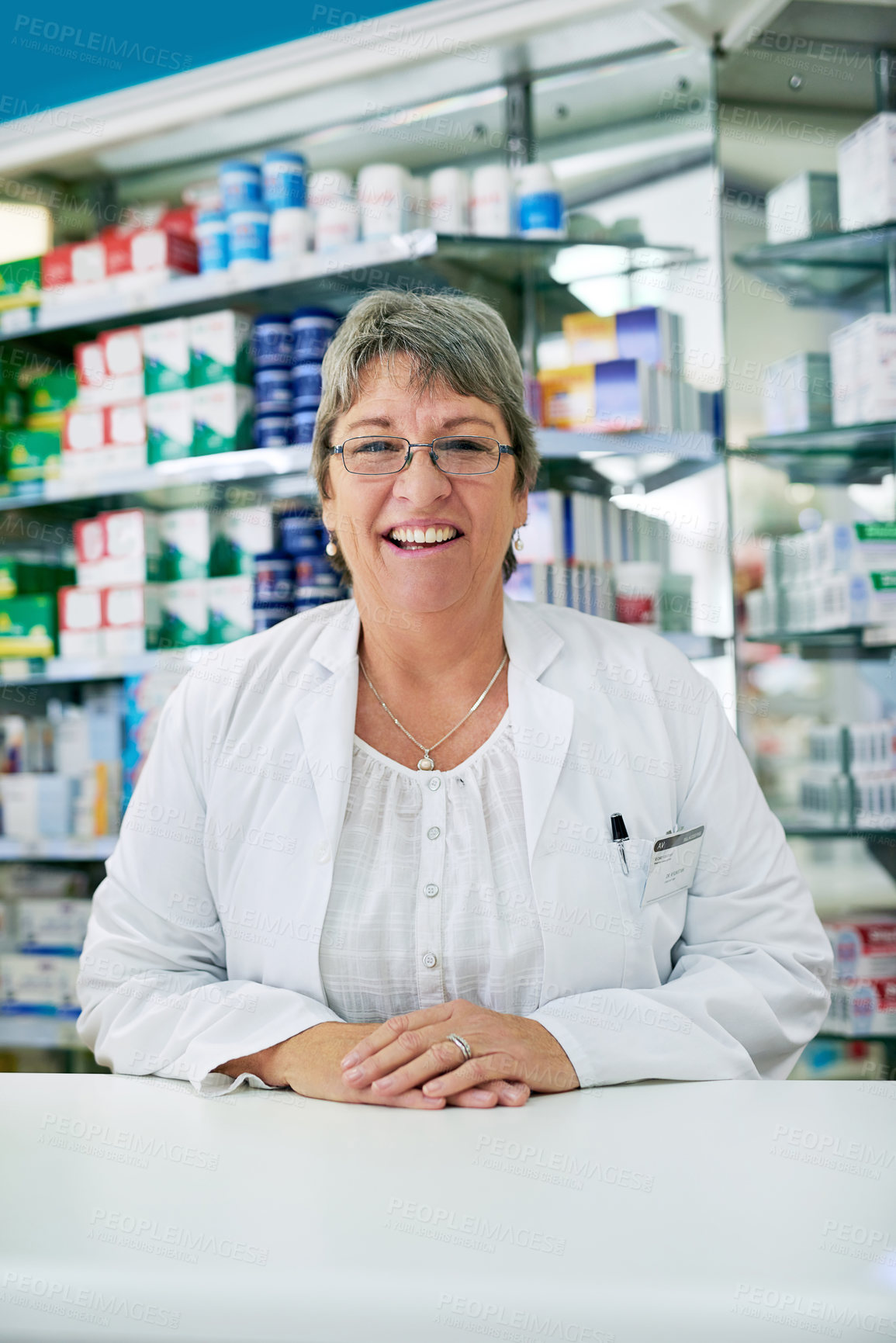 Buy stock photo Portrait of a happy mature woman working in a pharmacy