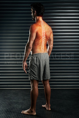 Buy stock photo Studio shot of a muscular young man with his spinal column showing through cgi