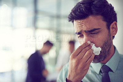 Buy stock photo Cropped shot of a businessman suffering with allergies in an office
