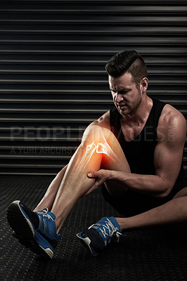 Buy stock photo Studio shot of an athletic young man warming up before a workout