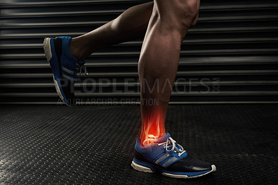 Buy stock photo Studio shot of an unrecognizable man working out with an ankle injury