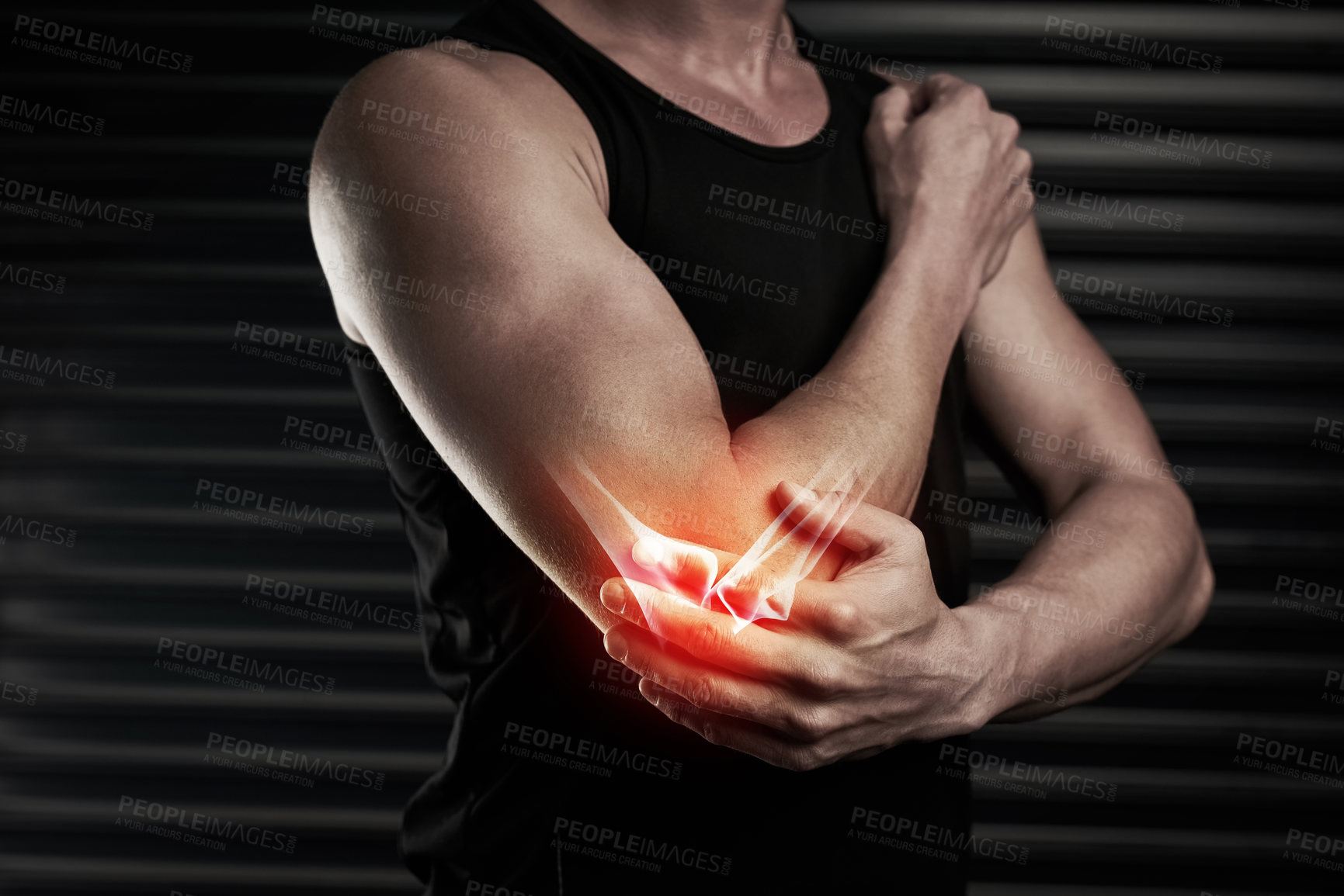 Buy stock photo Shot of an unrecognizable young man with an elbow injury in the studio