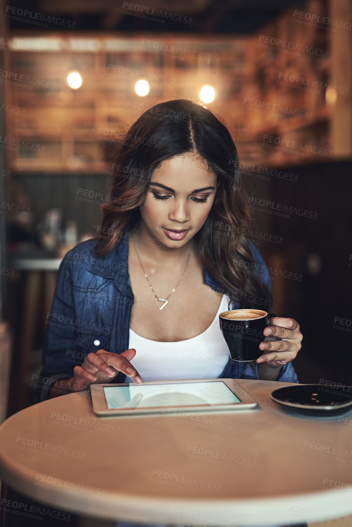 Buy stock photo Woman, tablet and coffee at night in cafe, reading ebook and scroll on social media on app. Female person, mockup screen and hot espresso for project proposal, planning and online in coffee shop