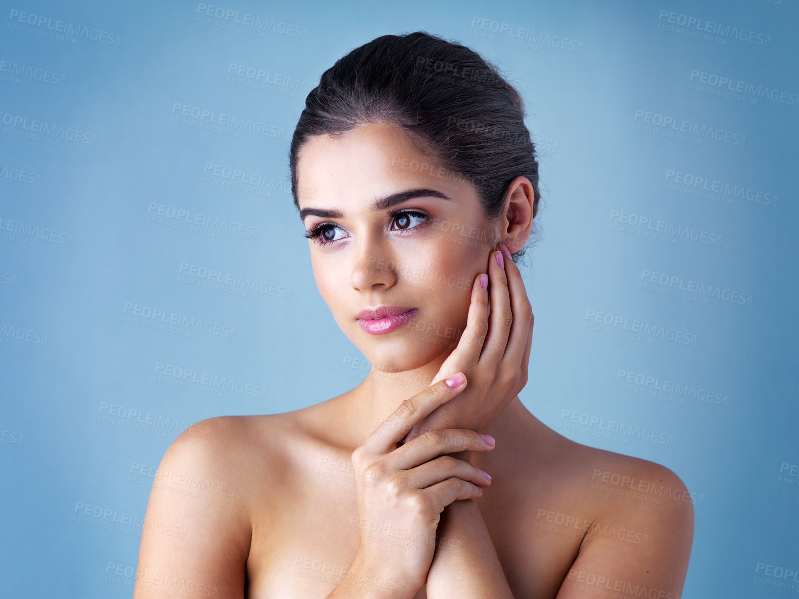Buy stock photo Beauty, thinking and woman in studio with natural skincare, confident makeup and luxury cosmetics. Dermatology, facial care and girl with wellness, relax and healthy skin glow on blue background.