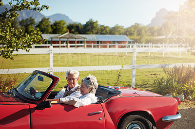 Buy stock photo Shot of a senior couple going on a road trip 