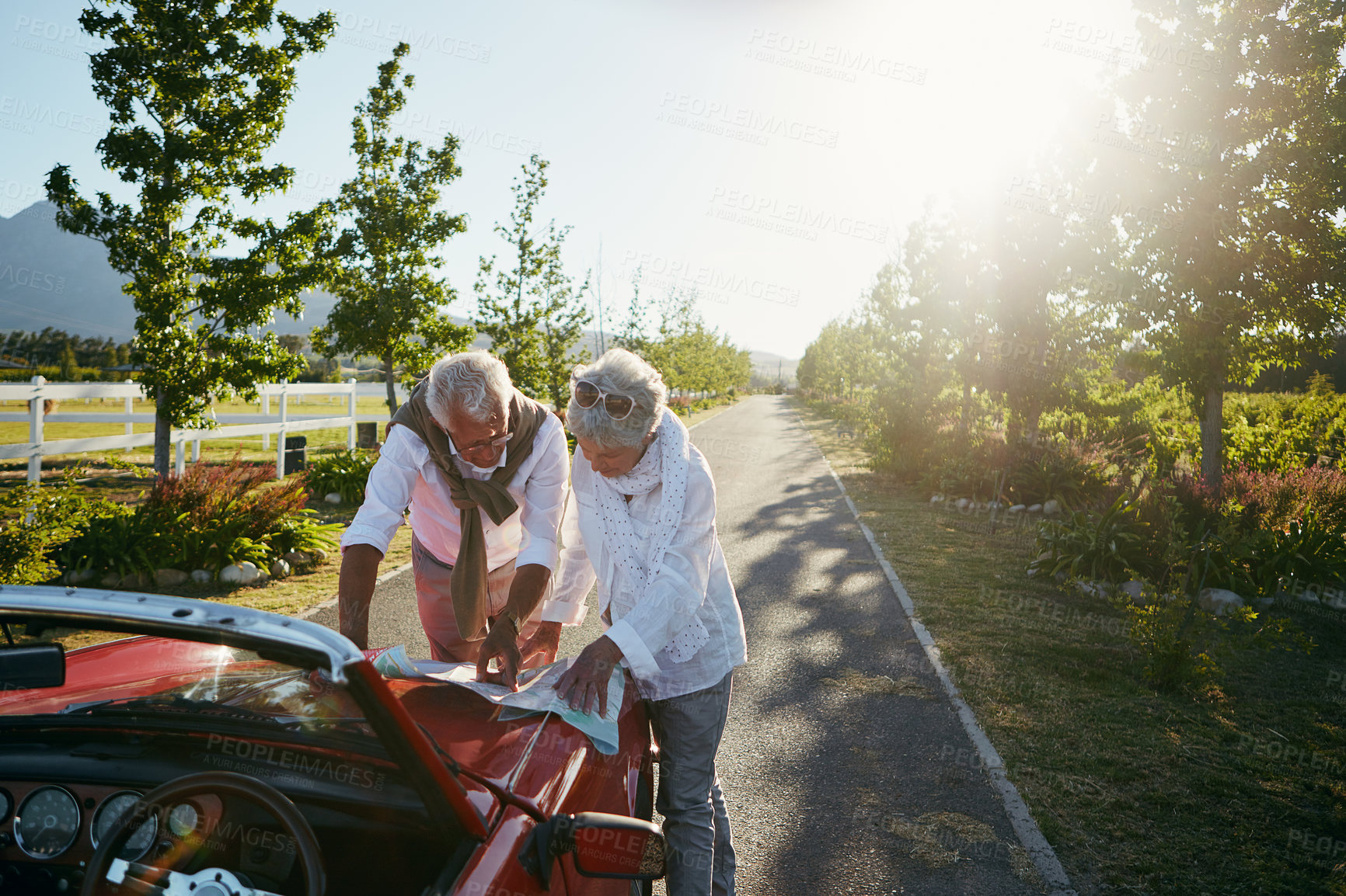 Buy stock photo Shot of a senior couple going on a road trip 