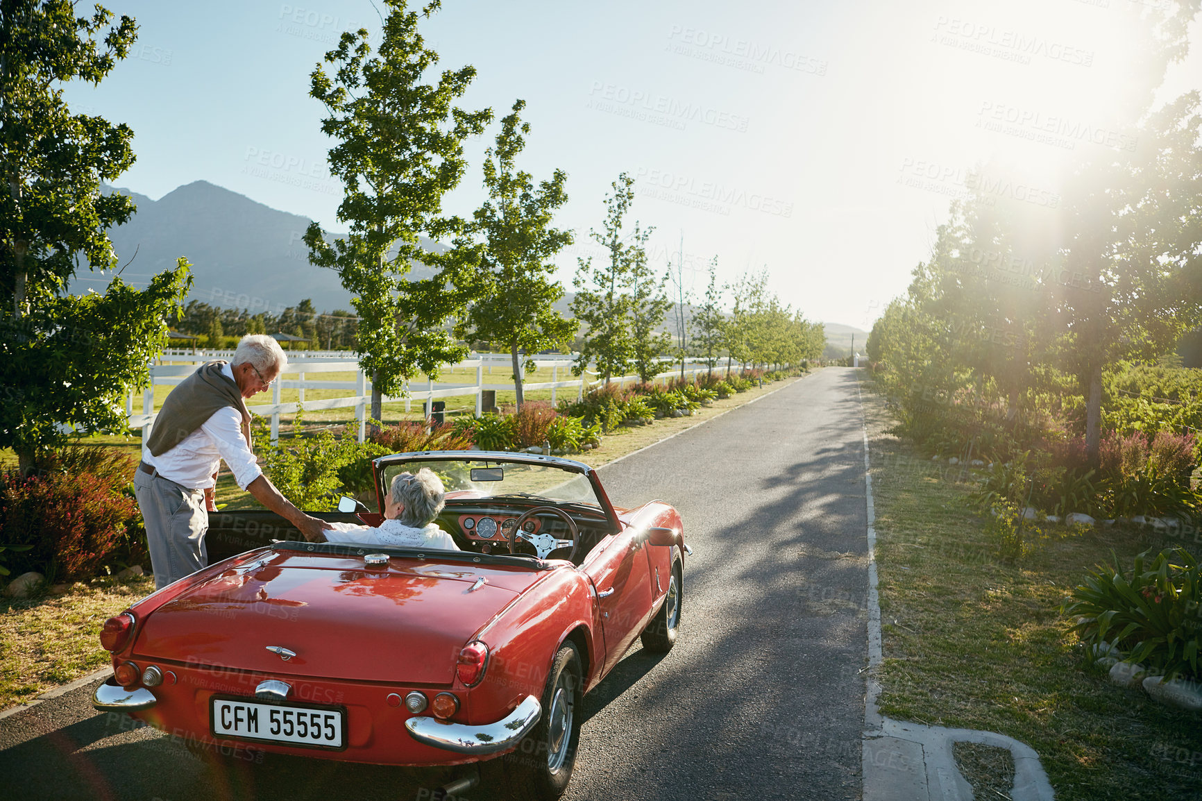 Buy stock photo Shot of a senior couple going on a road trip 