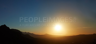 Buy stock photo Shot of the sun setting over the horizon