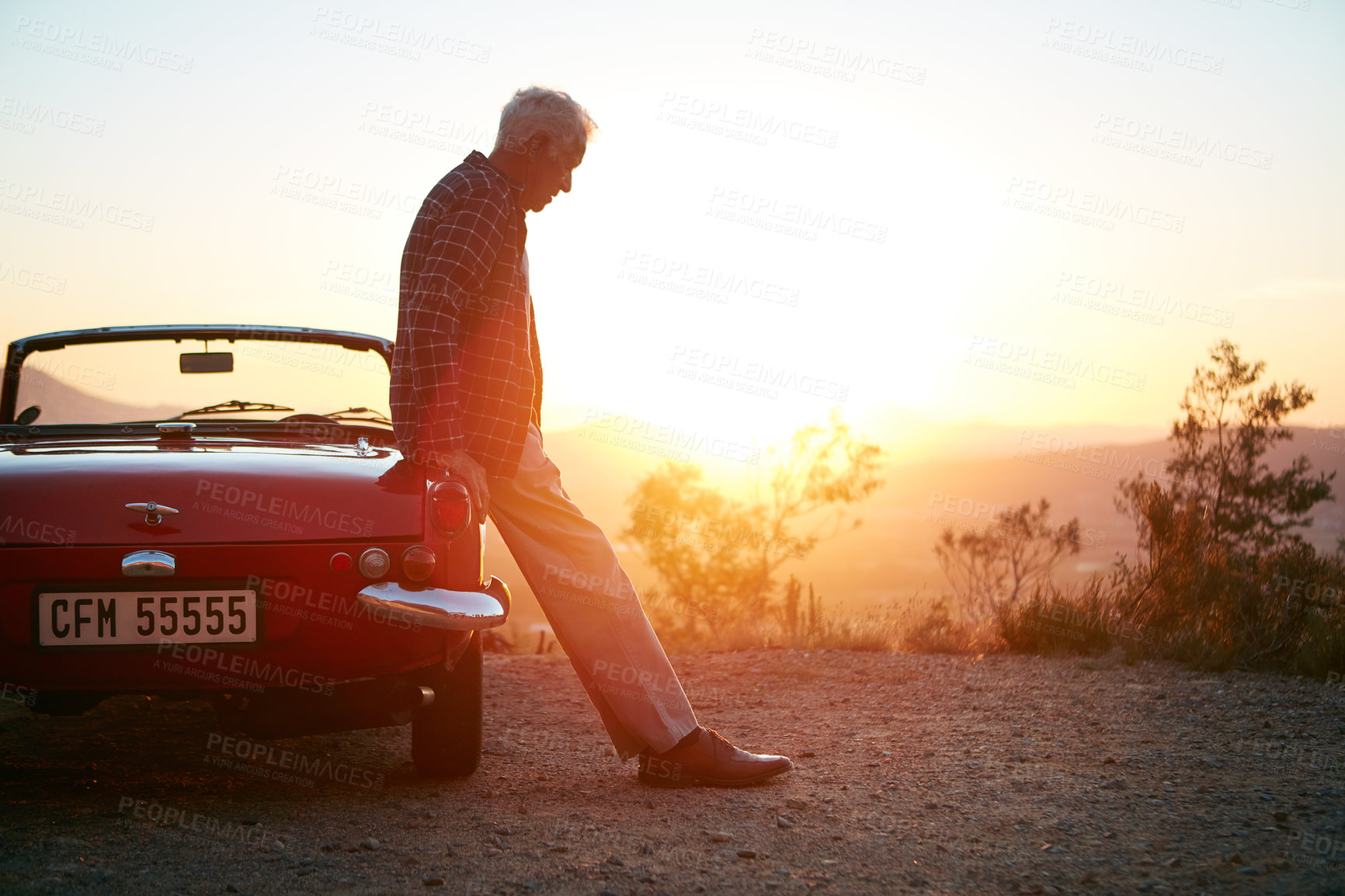 Buy stock photo Shot of a senior man out on a road trip