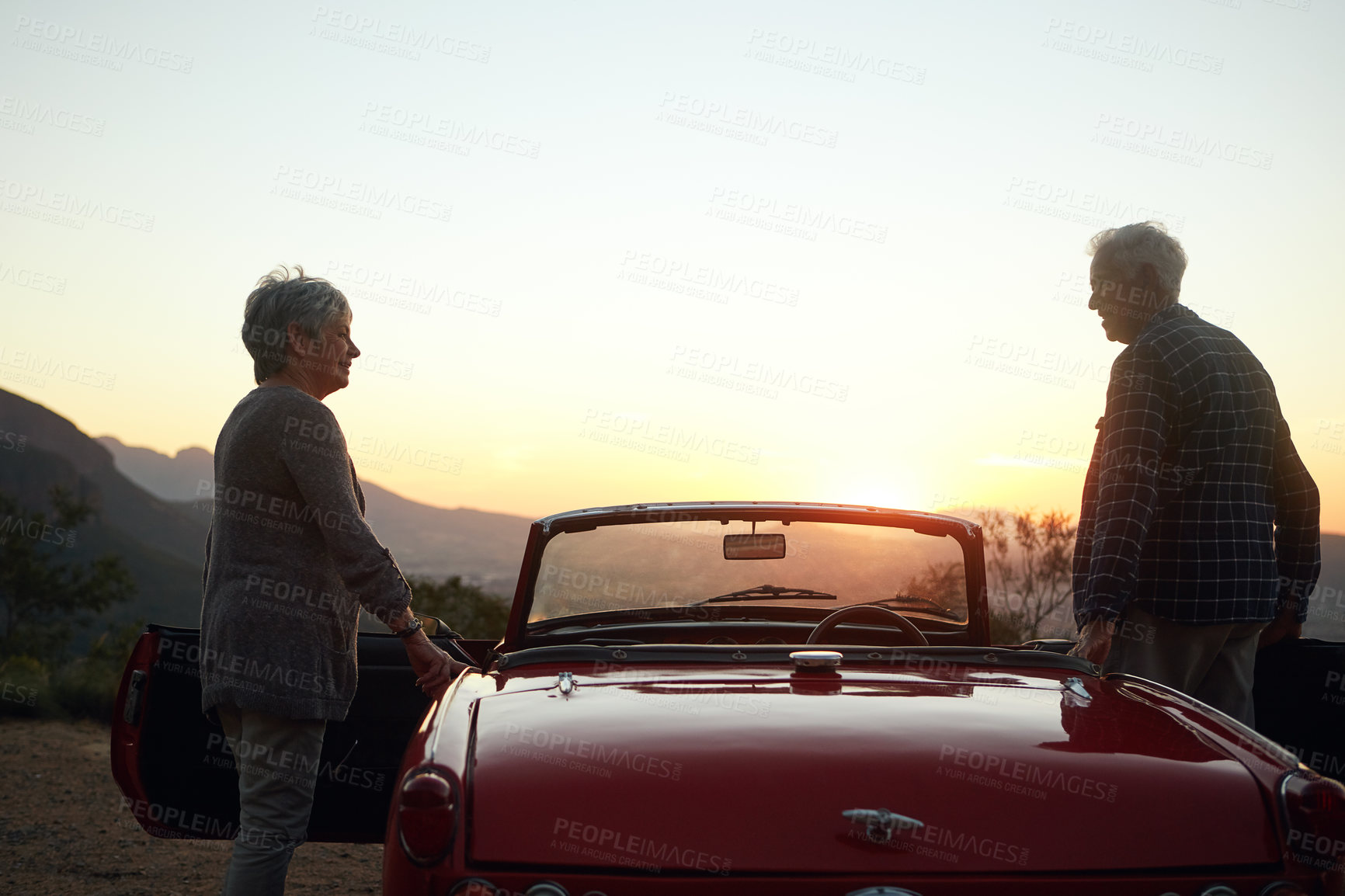 Buy stock photo Shot of a senior couple enjoying  a road trip