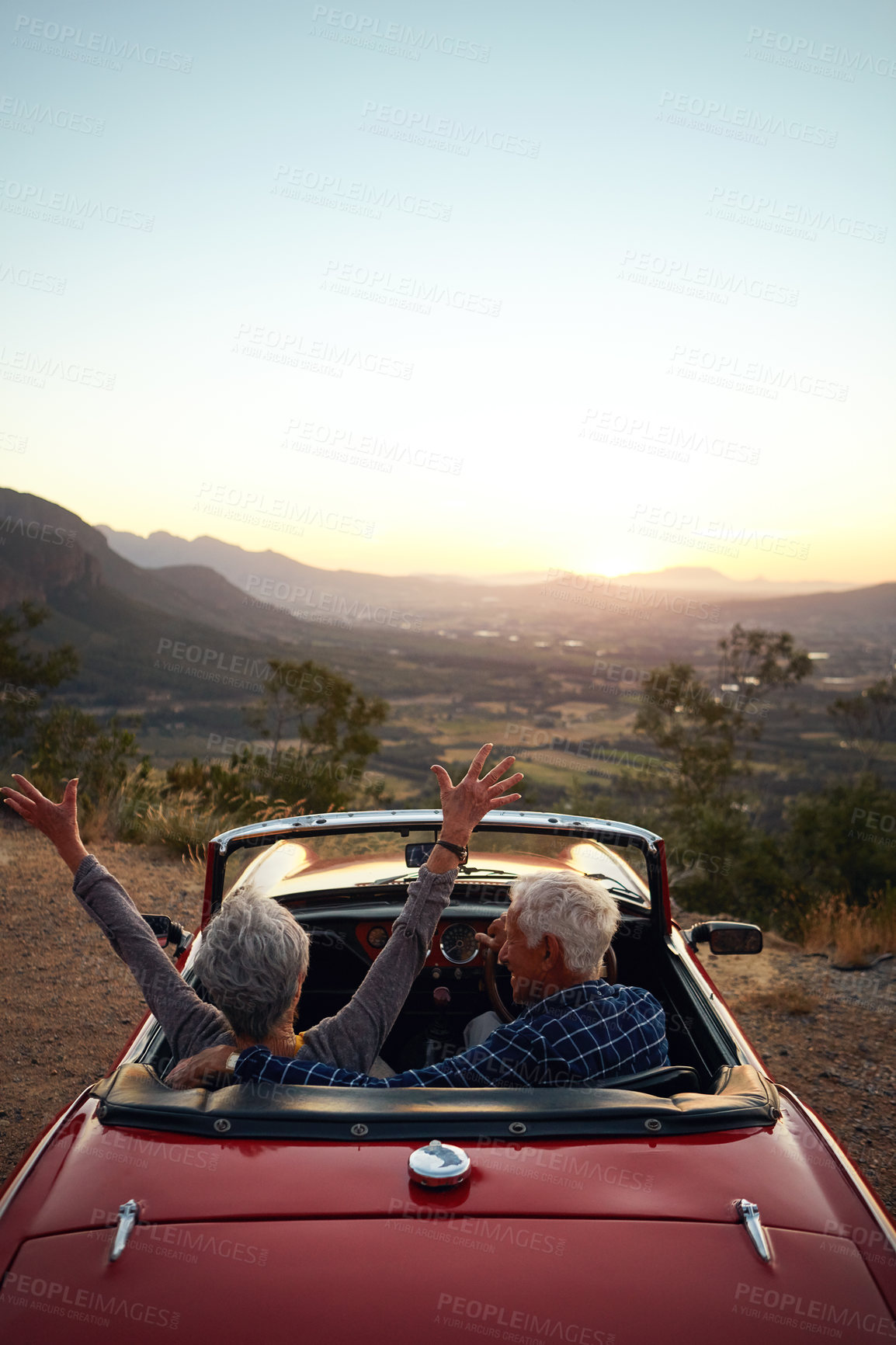 Buy stock photo Shot of a joyful senior couple enjoying  a road trip