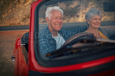 Buy stock photo Shot of a senior couple enjoying  a road trip