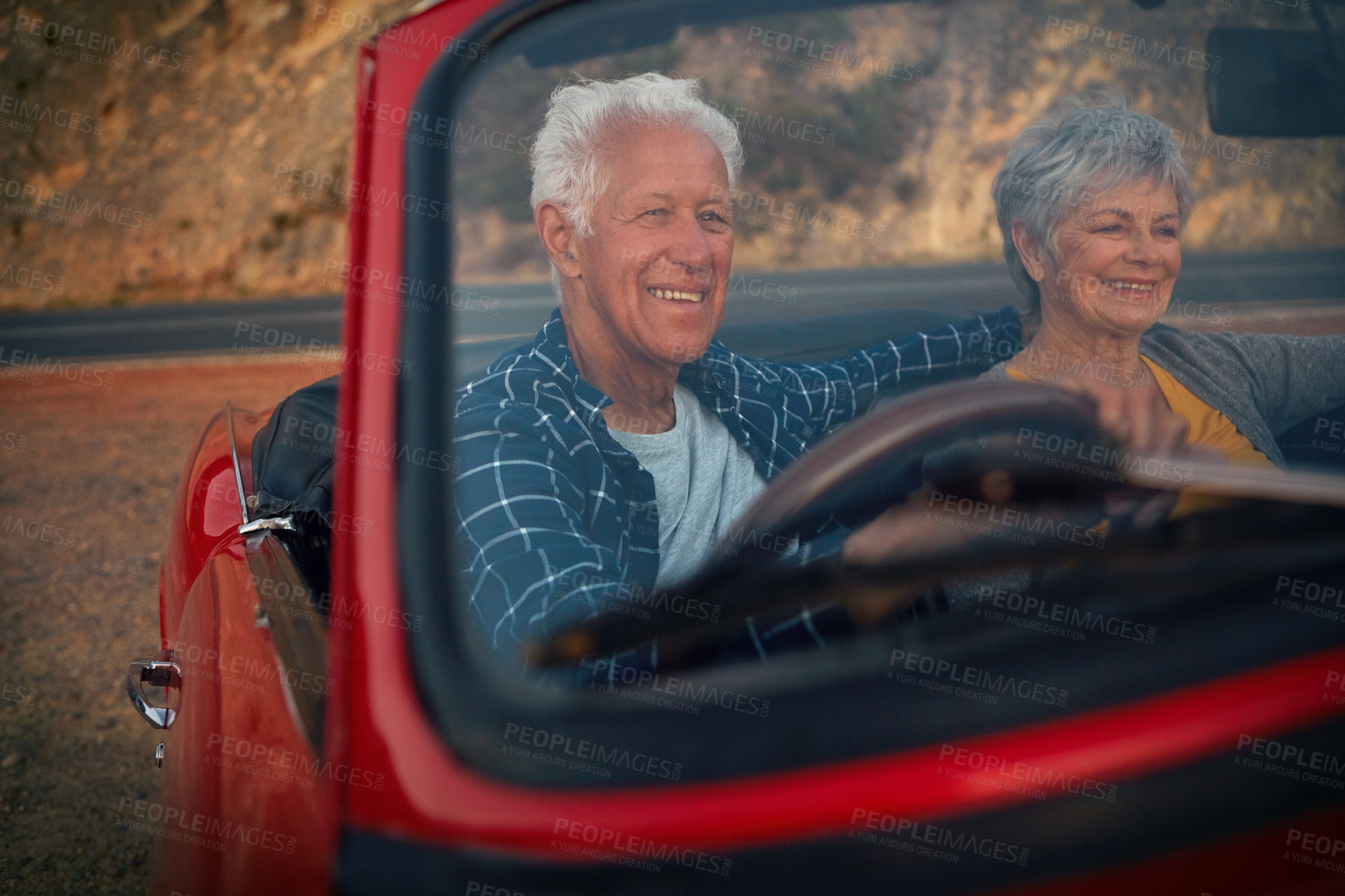 Buy stock photo Shot of a senior couple enjoying  a road trip