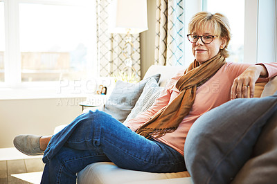 Buy stock photo Portrait, senior or happy woman in home to relax with freedom on living room sofa or couch. Apartment, glasses or mature lady with smile, peace or wellness in retirement, lounge or house for resting