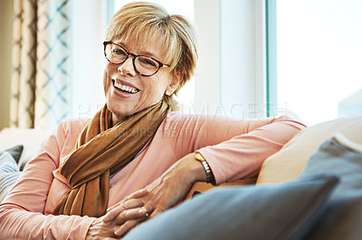 Buy stock photo Portrait, laugh or mature woman on couch to relax with happiness on living room sofa at home. Funny, happy or senior person with smile, peace or wellness in retirement, lounge or house for resting 