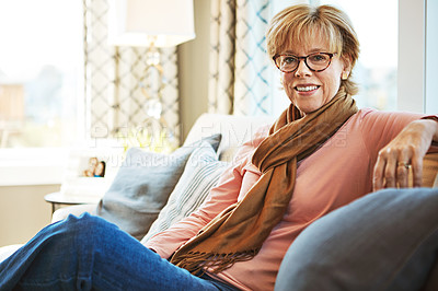 Buy stock photo Portrait, mature or happy woman on sofa to relax with freedom on living room couch at home. Apartment, glasses or senior lady with smile, peace or wellness in retirement, lounge or house for resting