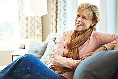 Buy stock photo Thinking, laugh or mature woman on sofa to relax with calm on living room sofa at home. Funny joke, happy or senior person with smile, peace or wellness in retirement, lounge or house for resting