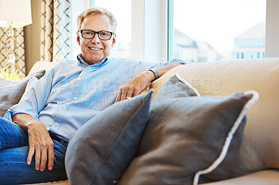 Buy stock photo Portrait, happy or mature man in living room to relax with freedom on couch or sofa at home. Apartment, face or senior person with smile or wellness in retirement, lounge or house for resting break