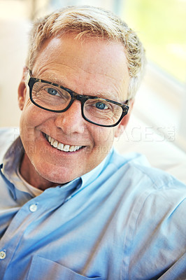 Buy stock photo Portrait, glasses or happy mature man in home living room to relax with freedom on sofa for resting break. Apartment, face or senior male person with smile or wellness in retirement, lounge or house