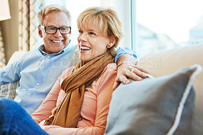 Buy stock photo Relax, happy and mature couple on sofa for bonding, healthy relationship and marriage. Retirement, home and senior man and woman laughing on couch for love, commitment and happiness in living room