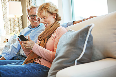 Buy stock photo Phone meme or mature or happy couple on social media for communication, website or internet connection. Smile, senior man or woman with mobile app to scroll online for a joke on couch or sofa at home